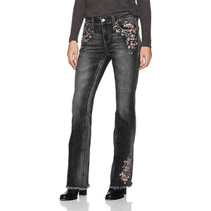 Jeans florales bordados, pirateados y elásticos