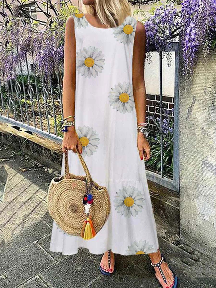 Un pequeño vestido sin mangas con un patrón de manzanilla.