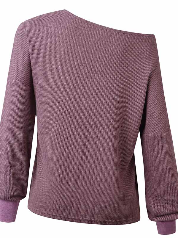 Blusa con cuello de pico y manga larga.