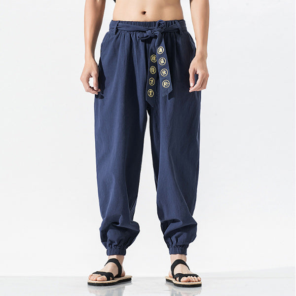 Pantalones casuales de algodón y lino bordados sueltos para hombres