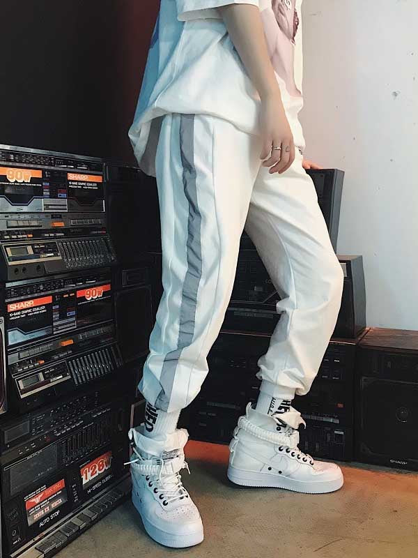 Pantalones hip-hop para hombre con efecto reflectante.