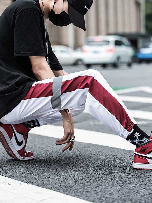 Pantalones hip-hop para hombre con efecto reflectante.
