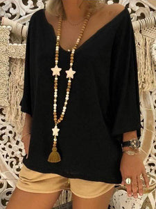 Camisa oversize con cuello de pico