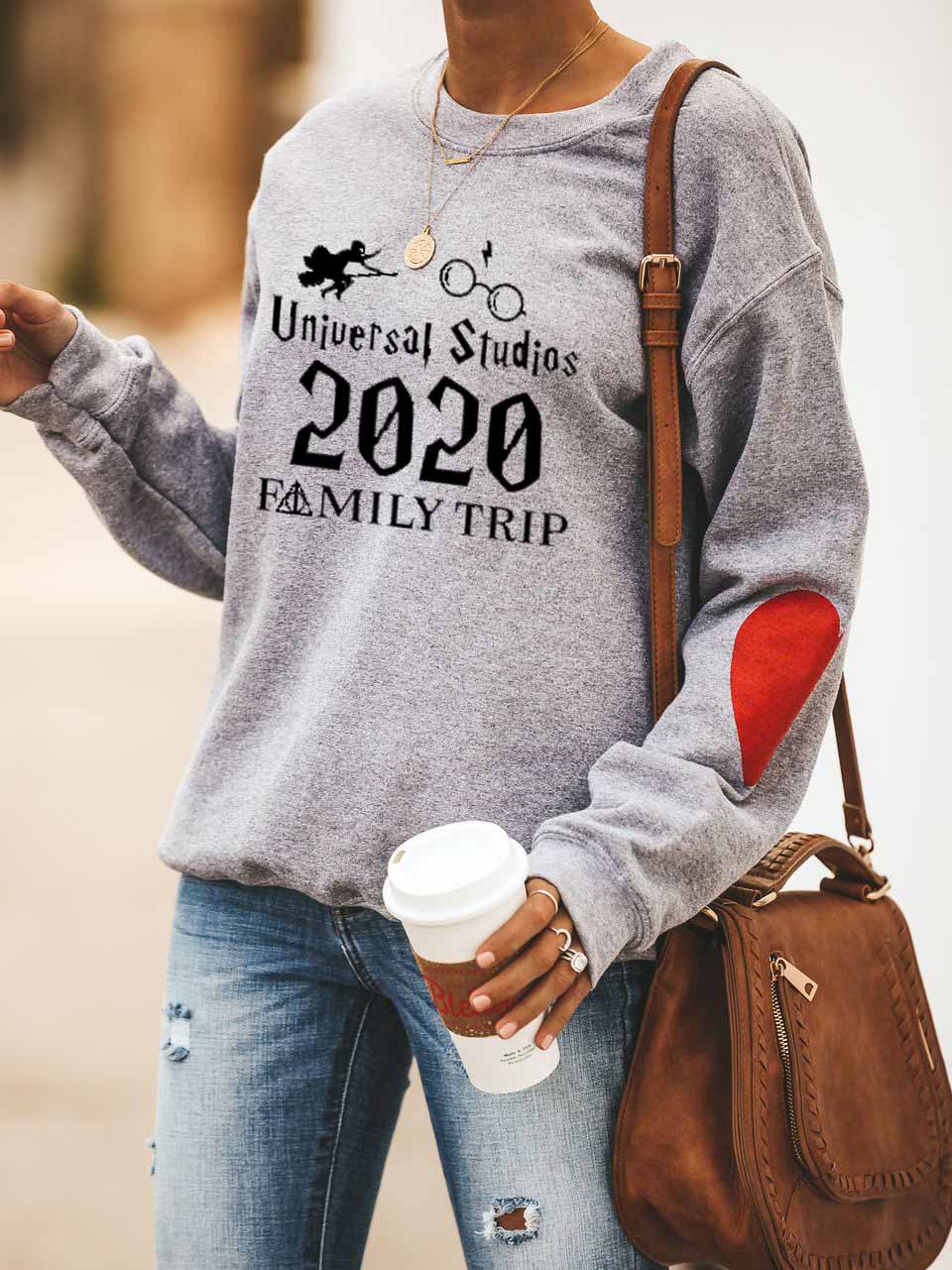 Moterų „Universal Studios“ šeimos išvykų spausdinimo „Peach Heart“ megztinis