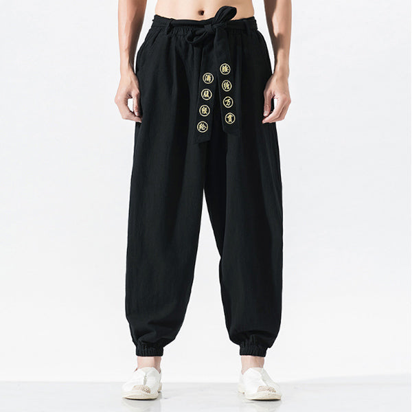 Pantalones casuales de algodón y lino bordados sueltos para hombres