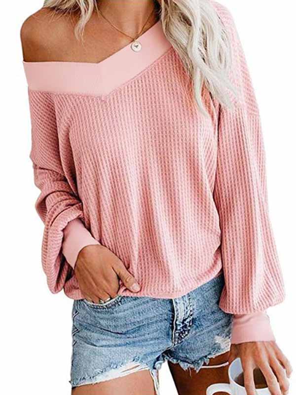 Blusa con cuello de pico y manga larga.