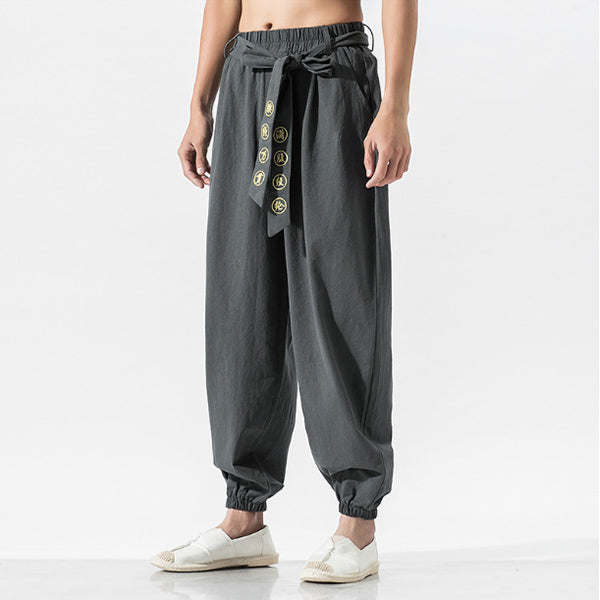 Pantalones casuales de algodón y lino bordados sueltos para hombres